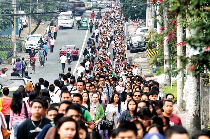 People lined up to ride the MRT. It's just another day in Metro Manila.  (Photo by Mark Balmores)